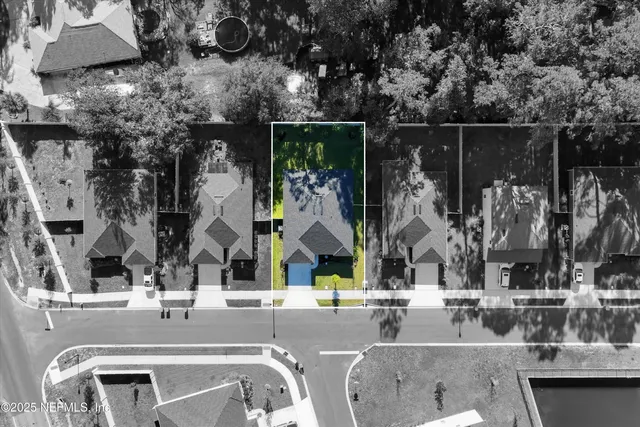 a view of swimming pool with outdoor seating and house in the background