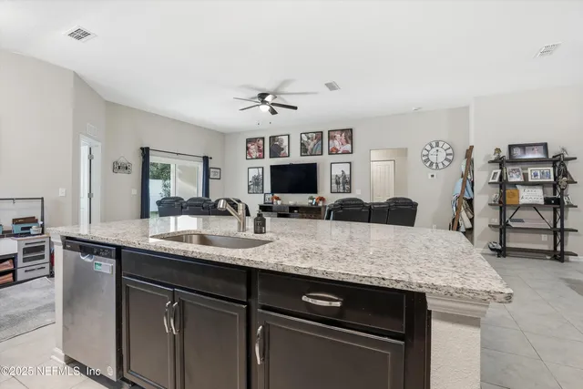 a kitchen with cabinets and center island