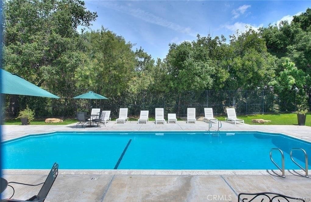 2690 Indian Creek Road Diamond Bar, CA 91765 - Photo 16 of 17 a front view of a house with swimming pool table and chairs