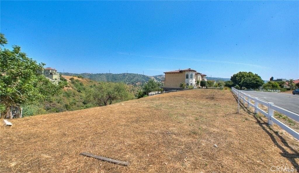 2690 Indian Creek Road Diamond Bar, CA 91765 - Photo 5 of 17 a view of a road with a yard