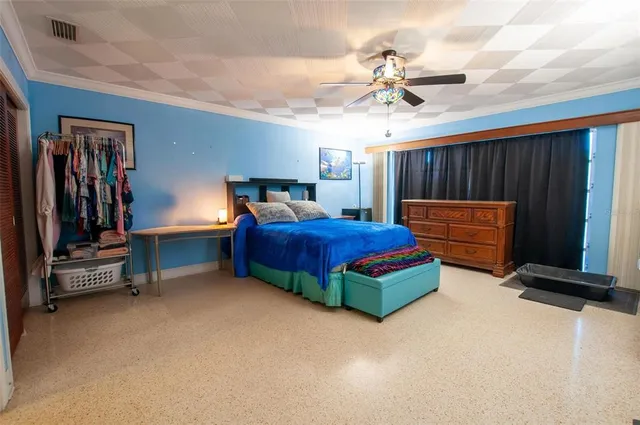 a bedroom with furniture and a chandelier