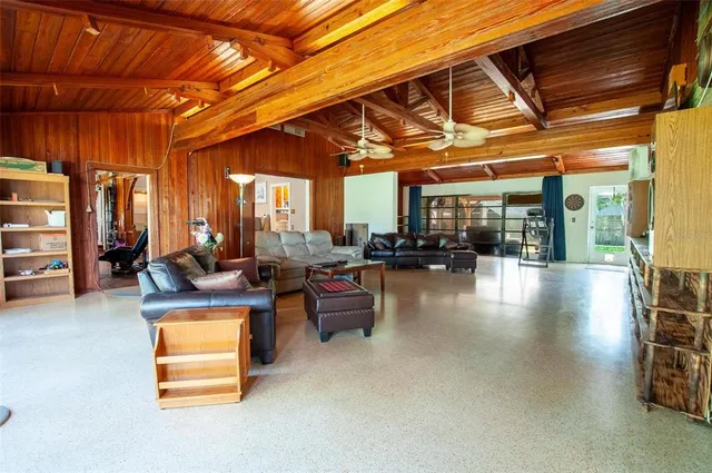 a living room with furniture and a patio