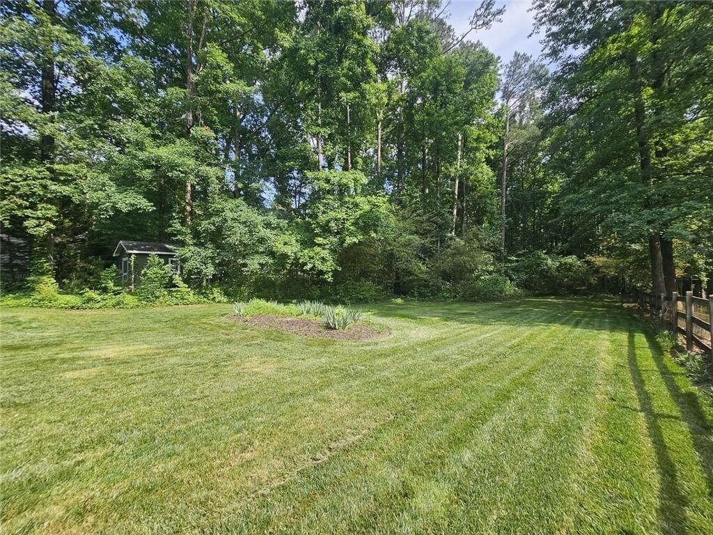 290 Oakmere Road Alpharetta, GA 30009 - Photo 24 of 26 a view of a field with a tree