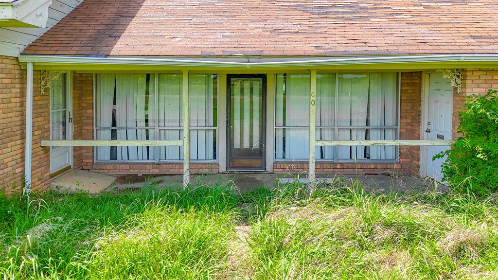 604 Main Street Richland, TX 76681 - Photo 12 of 15 a house with garden in front of it