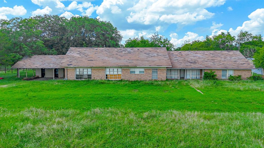 604 Main Street Richland, TX 76681 - Photo 3 of 15 a view of a house with a yard