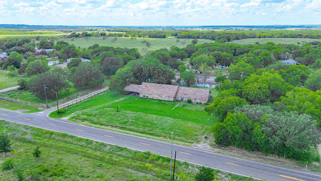604 Main Street Richland, TX 76681 - Photo 5 of 15 a view of a yard with a garden