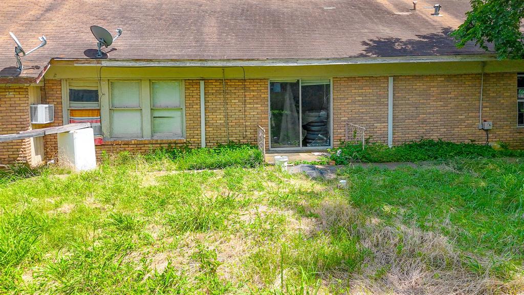 604 Main Street Richland, TX 76681 - Photo 8 of 15 a front view of a house with a yard