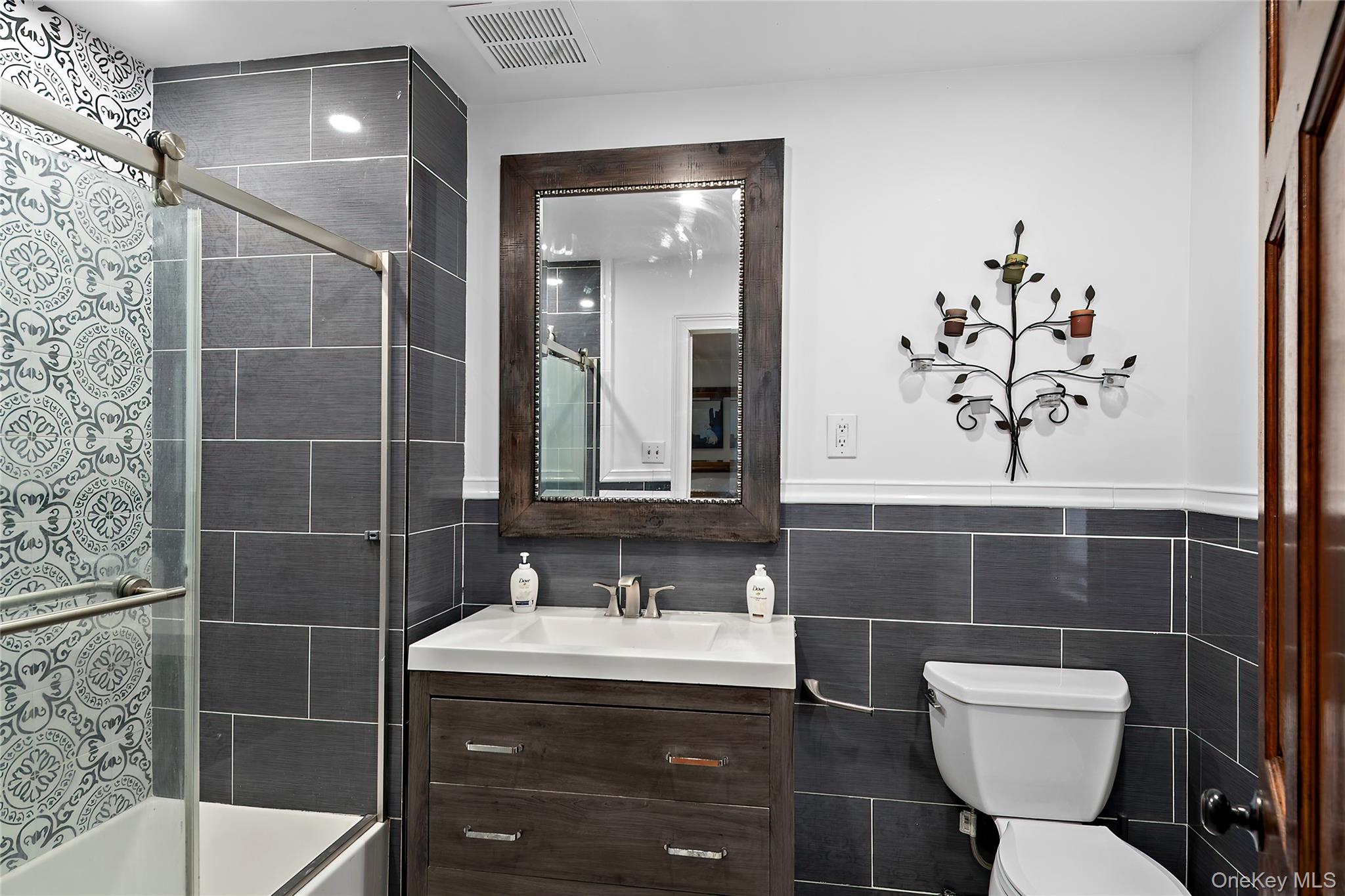 137 South Highland Road Wappingers Falls, NY 12590 - Photo 12 of 39 a bathroom with a toilet sink and mirror