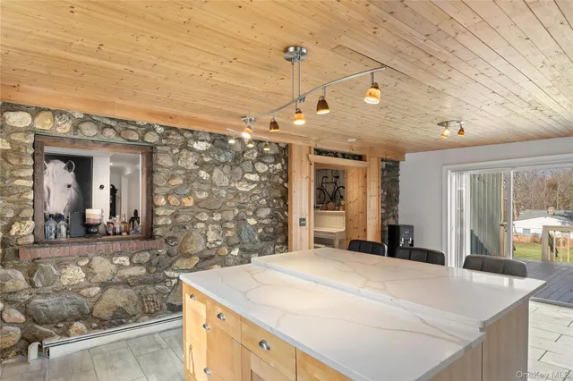 a kitchen with a sink and a refrigerator