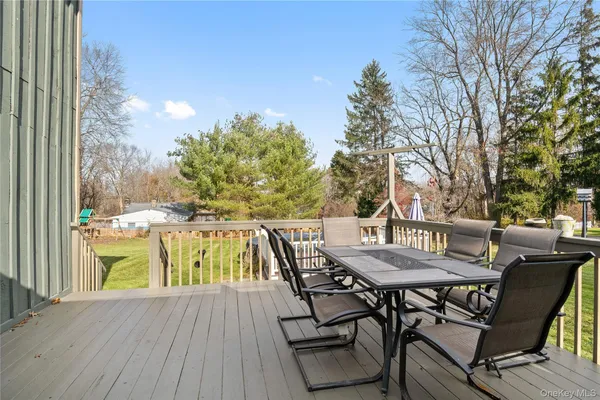 a view of outdoor space with deck and yard