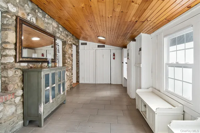 a bathroom with a double vanity sink a toilet and a shower