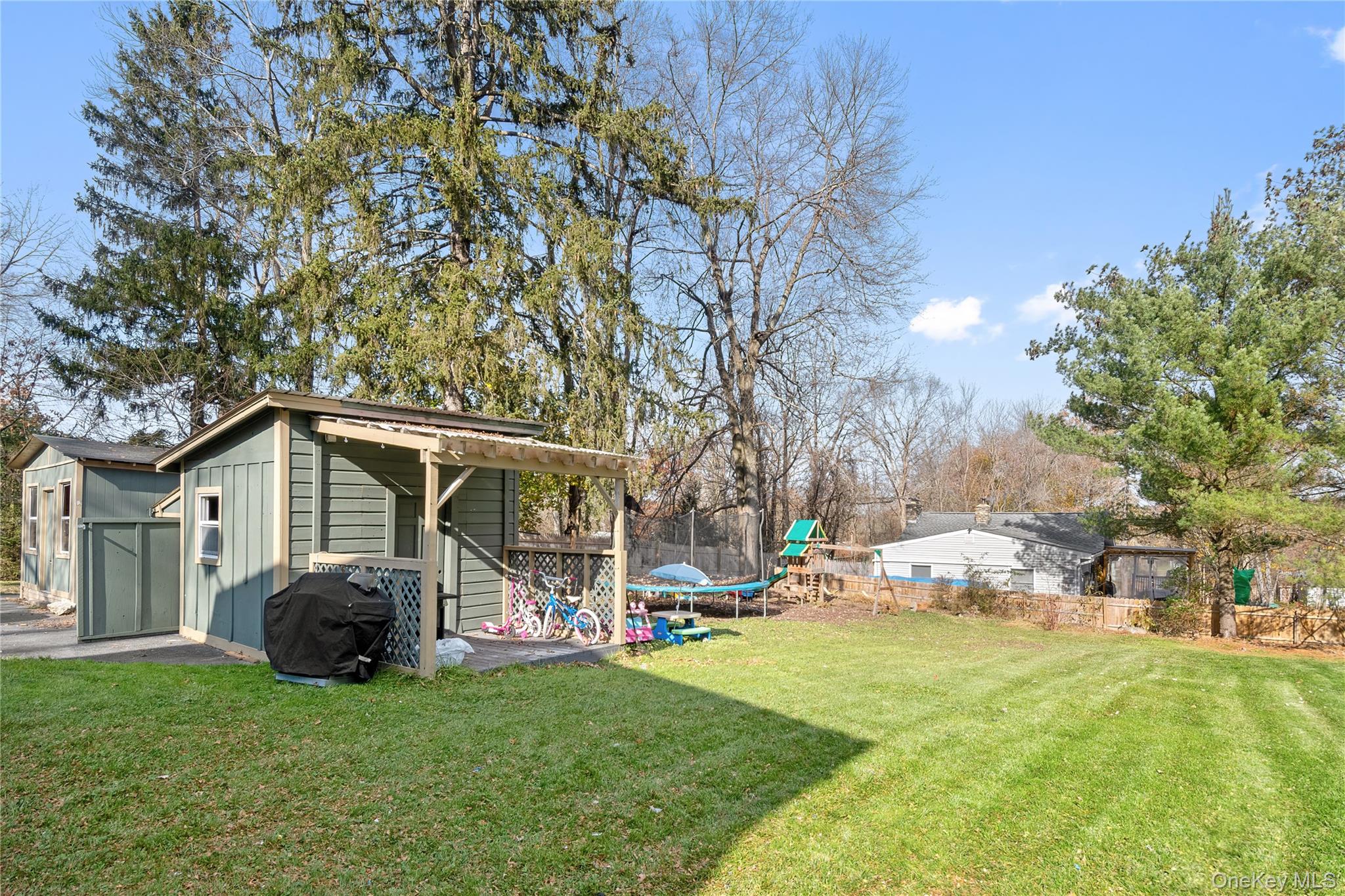 137 South Highland Road Wappingers Falls, NY 12590 - Photo 33 of 39 a view of a back yard of the house with green space and porch area