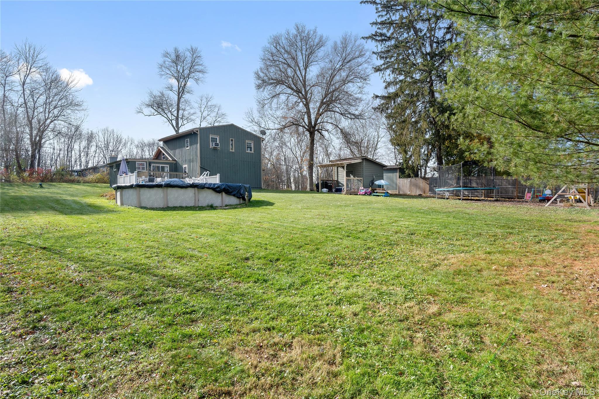 137 South Highland Road Wappingers Falls, NY 12590 - Photo 38 of 39 a view of a house with a big yard and large trees
