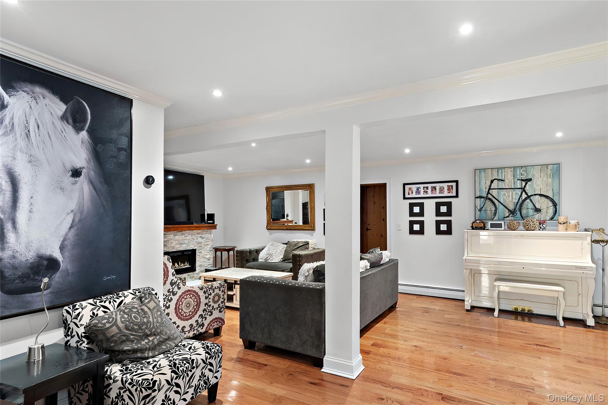 137 South Highland Road Wappingers Falls, NY 12590 - Photo 6 of 39 a living room with furniture and a wooden floor