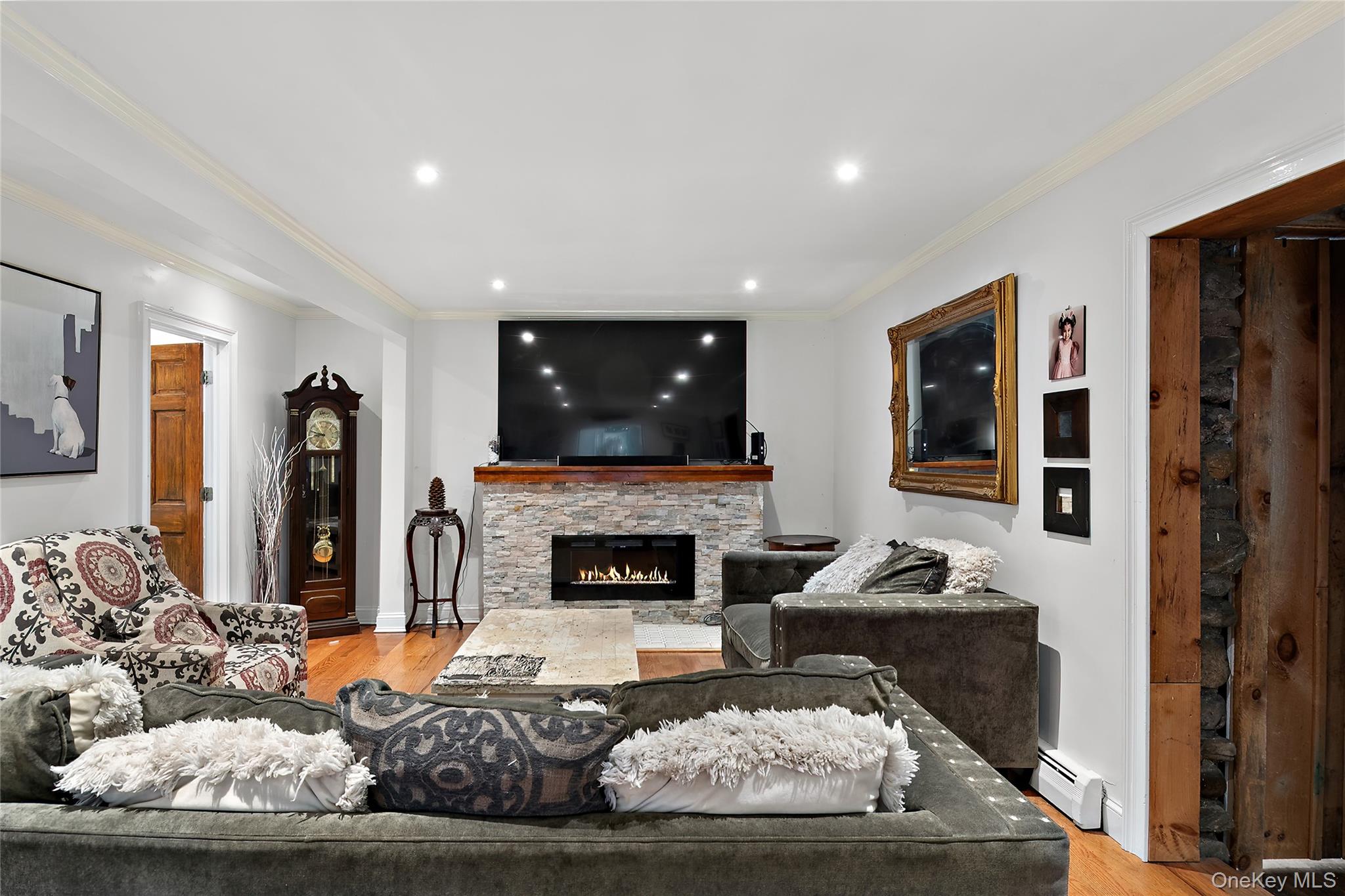 137 South Highland Road Wappingers Falls, NY 12590 - Photo 10 of 39 a living room with furniture and a fireplace