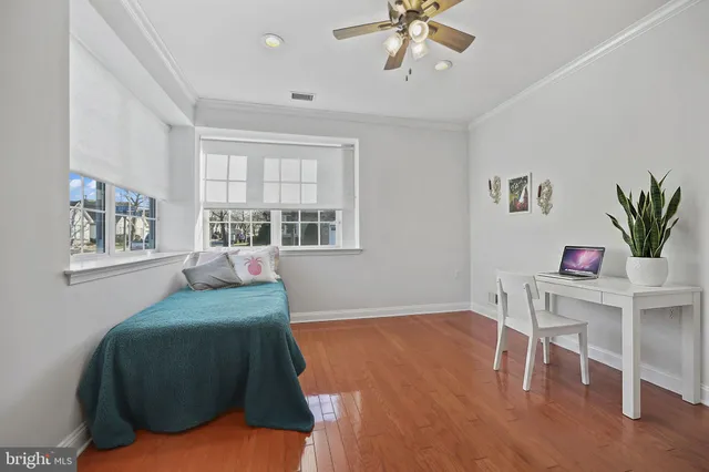 a bedroom with furniture and a window