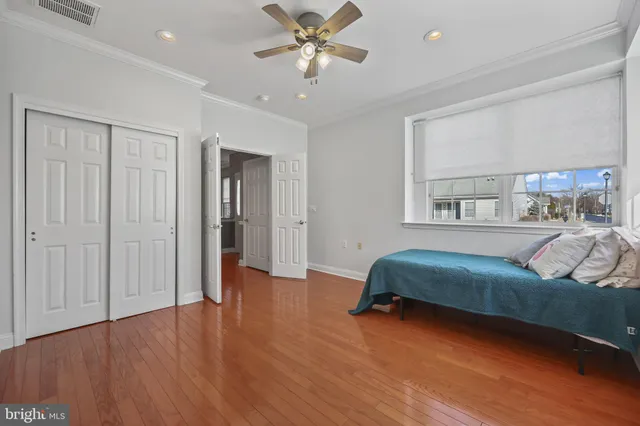 a bedroom with furniture and window