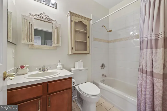 a bathroom with a sink toilet a mirror and shower