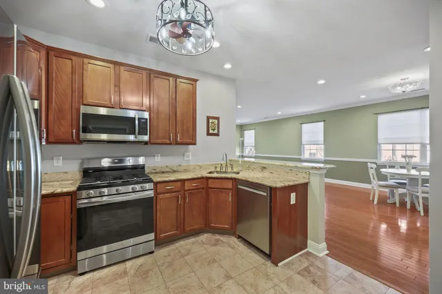 a kitchen with a stove sink and microwave