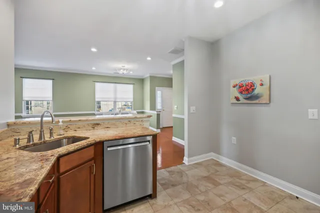 a kitchen with a sink and a refrigerator