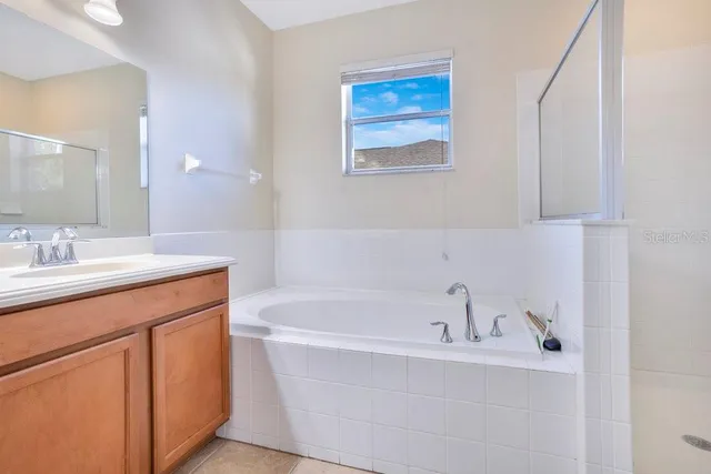 a bathroom with a bathtub and a sink