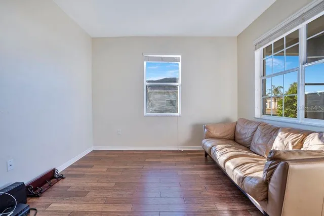 a living room with furniture and a window