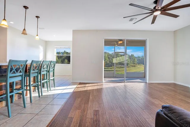 a view of room with furniture and wooden floor