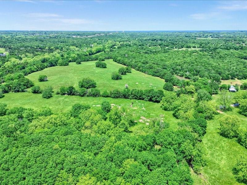 1747 Desvoignes Road Denison, TX 75021 - Photo 15 of 40 a view of a green field with lots of plants in it