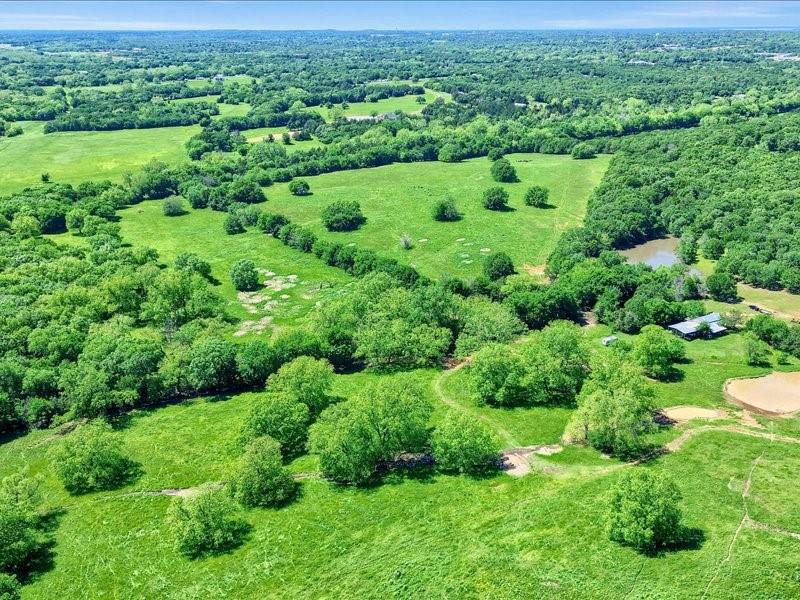 1747 Desvoignes Road Denison, TX 75021 - Photo 24 of 40 an aerial view of a yard with green space