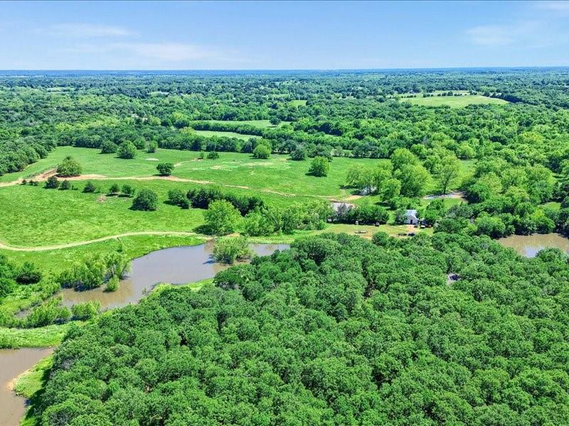 1747 Desvoignes Road Denison, TX 75021 - Photo 27 of 40 an aerial view of a house with a yard