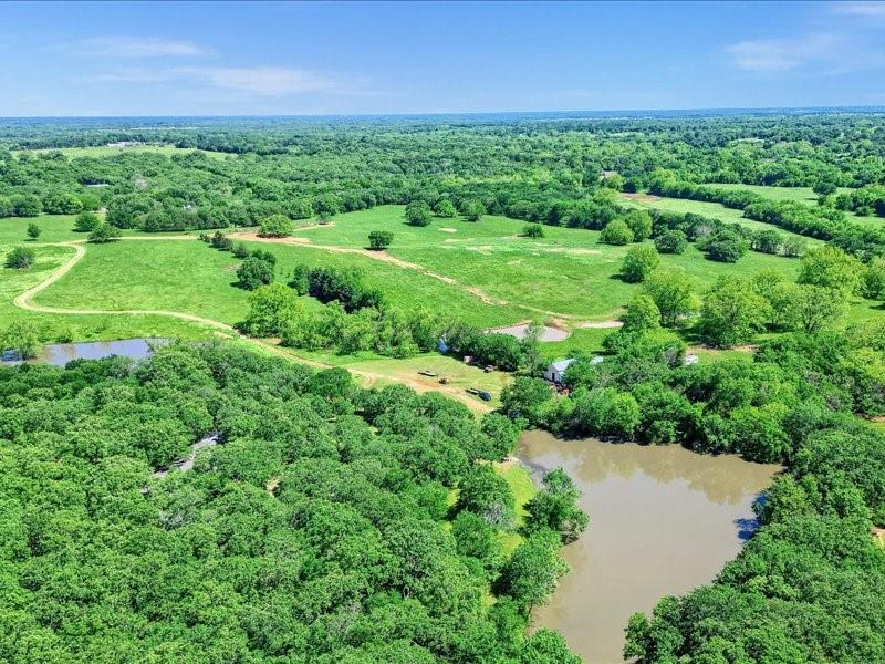 1747 Desvoignes Road Denison, TX 75021 - Photo 28 of 40 an aerial view of a house with a yard and outdoor space