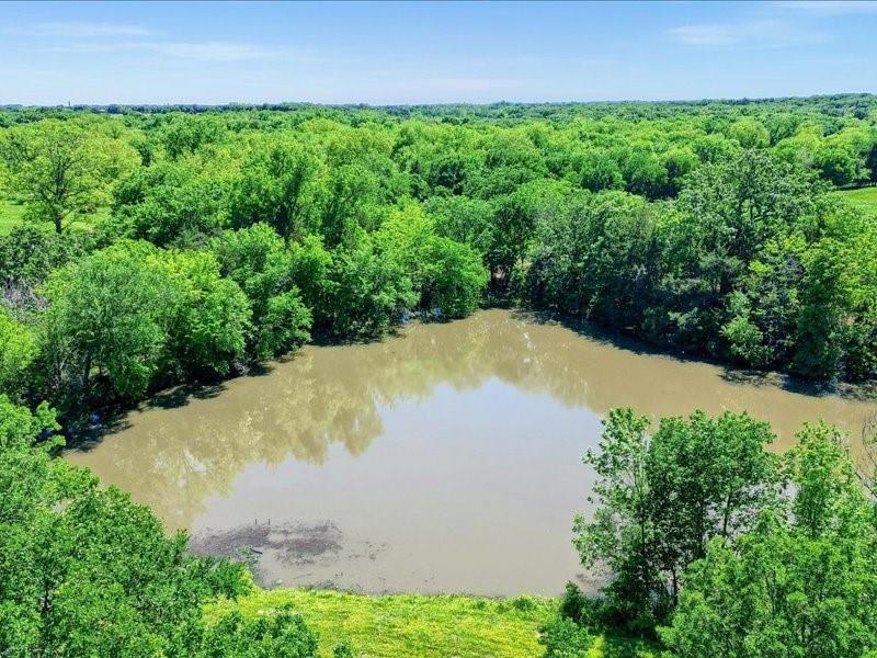 1747 Desvoignes Road Denison, TX 75021 - Photo 29 of 40 a view of a yard with plants and large trees