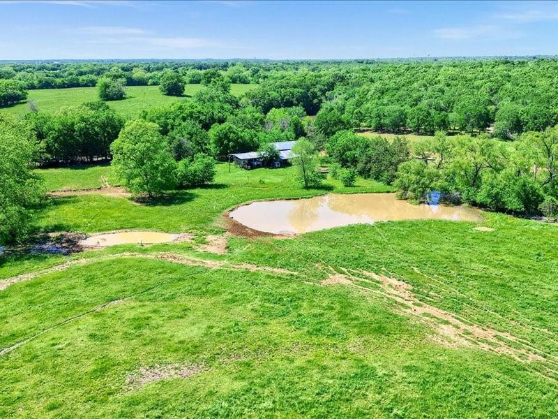 1747 Desvoignes Road Denison, TX 75021 - Photo 33 of 40 a view of a backyard with a garden