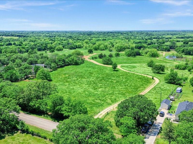 1747 Desvoignes Road Denison, TX 75021 - Photo 6 of 40 a view of a lush green space
