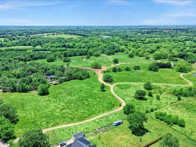 1747 Desvoignes Road Denison, TX 75021 - Photo 7 of 40 a view of a green field with lots of plants in it