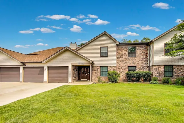 a view of house with backyard