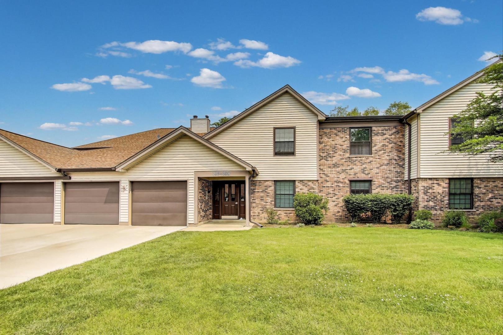 a view of house with backyard