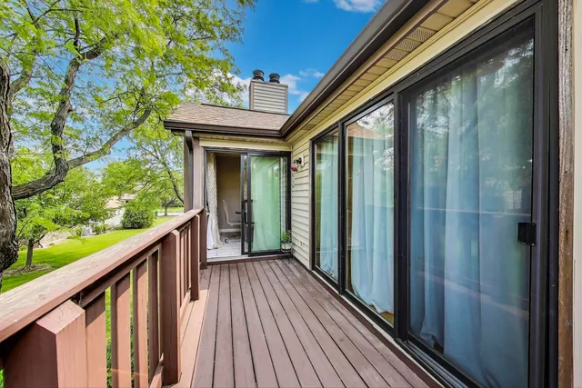 a view of balcony with wooden floor