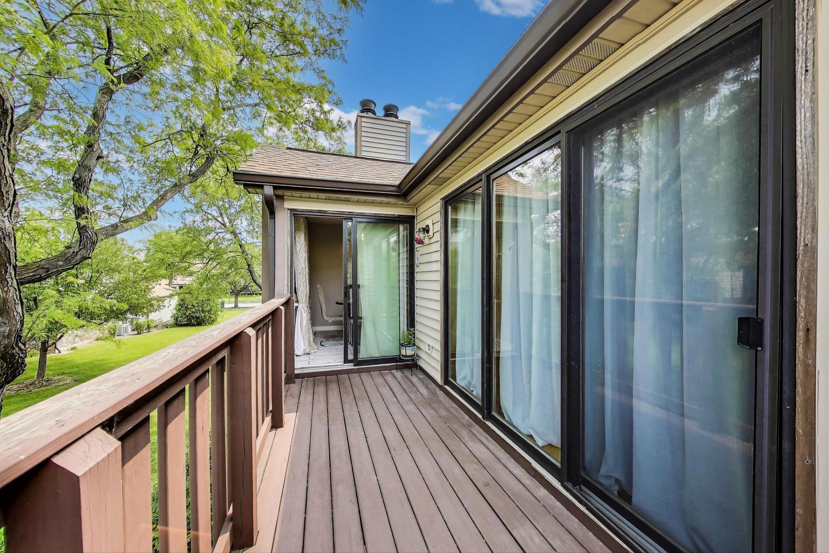 738 Hapsfield Lane, Unit 7A2 Buffalo Grove, IL 60089 - Photo 25 of 29 a view of balcony with wooden floor
