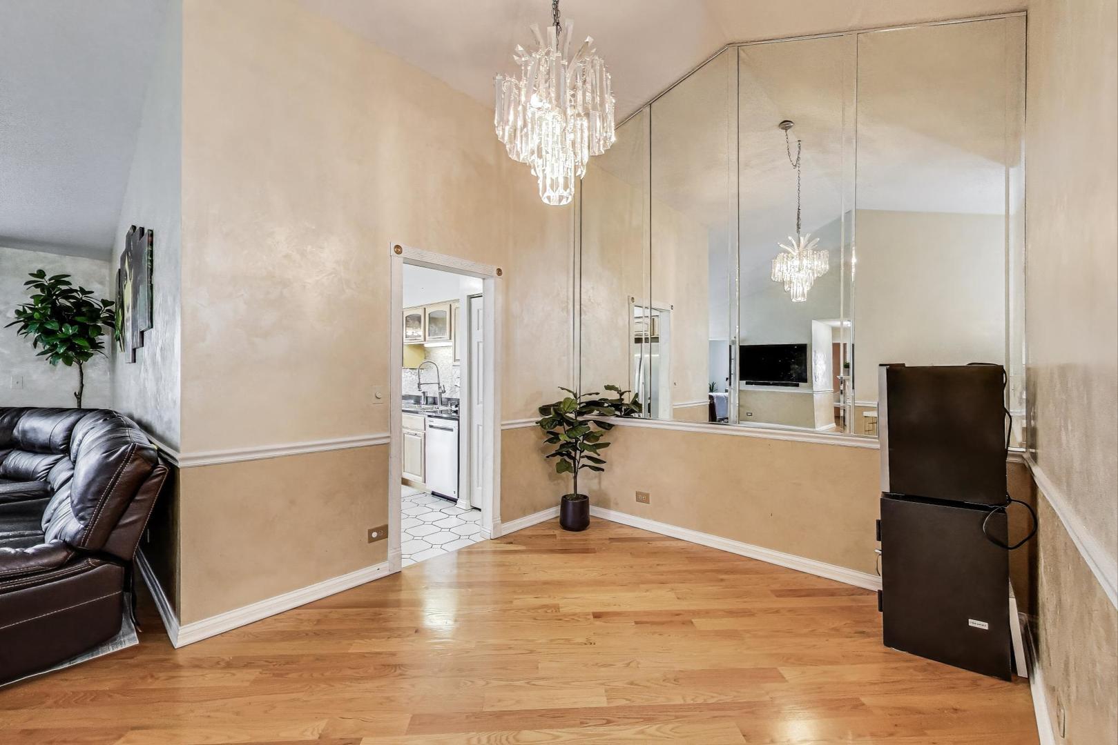738 Hapsfield Lane, Unit 7A2 Buffalo Grove, IL 60089 - Photo 7 of 29 a view of a kitchen with kitchen island a counter top space and stainless steel appliances