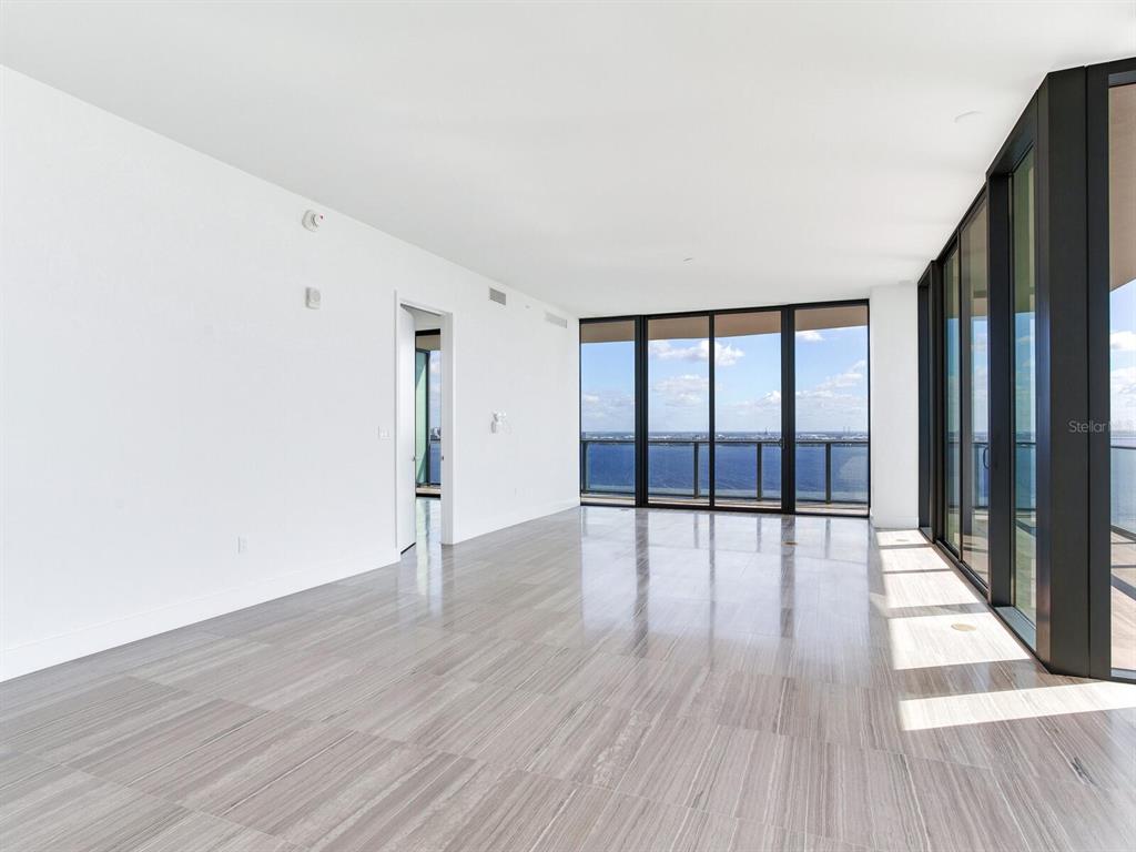 3101 Bayshore Boulevard, Unit 2204 Tampa, FL 33629 - Photo 13 of 60 wooden floor in an empty room with a window