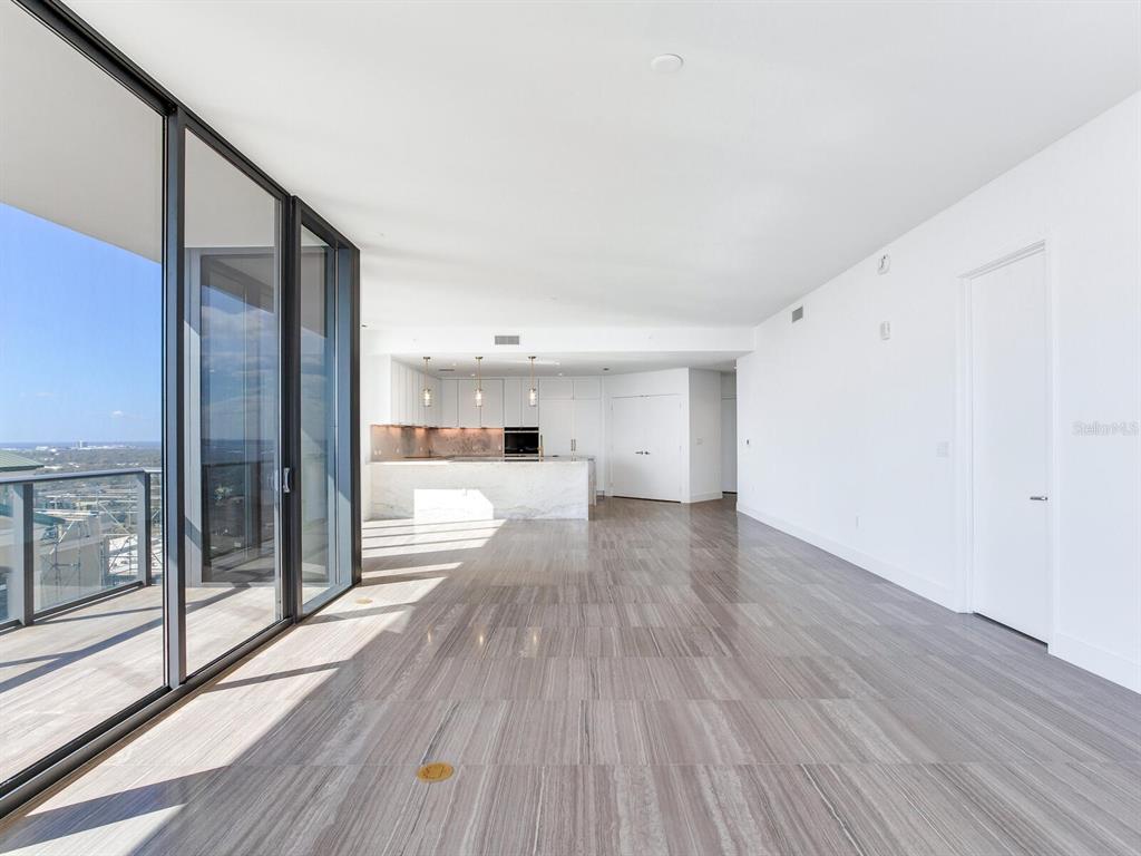 3101 Bayshore Boulevard, Unit 2204 Tampa, FL 33629 - Photo 16 of 60 a view of a living room hardwood floor and a large window