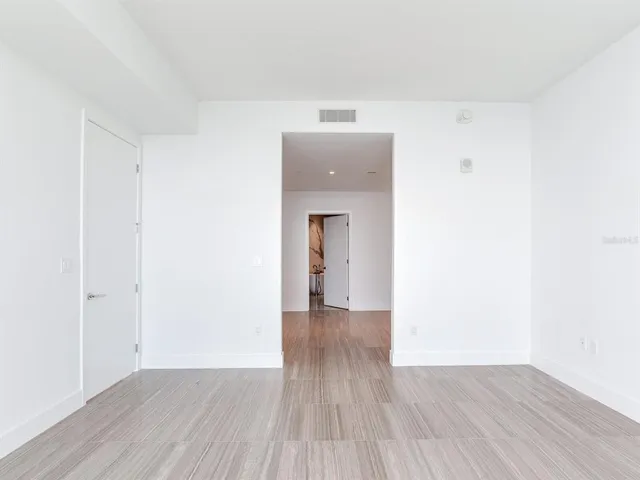 a bathroom with a double vanity sink and a bathtub