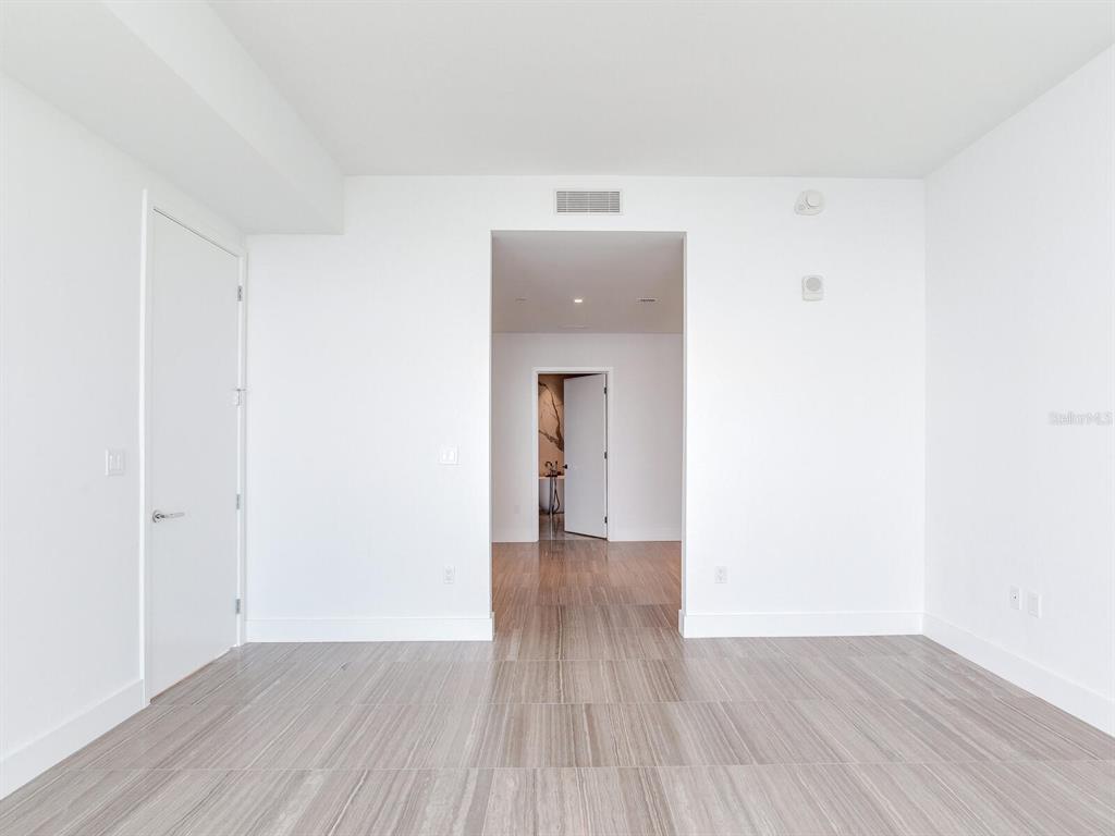 3101 Bayshore Boulevard, Unit 2204 Tampa, FL 33629 - Photo 20 of 60 a view of a hallway with wooden floor