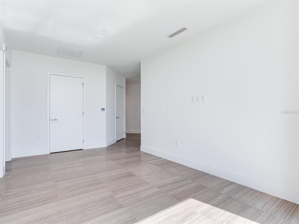 3101 Bayshore Boulevard, Unit 2204 Tampa, FL 33629 - Photo 39 of 60 a view of an empty room with wooden floor