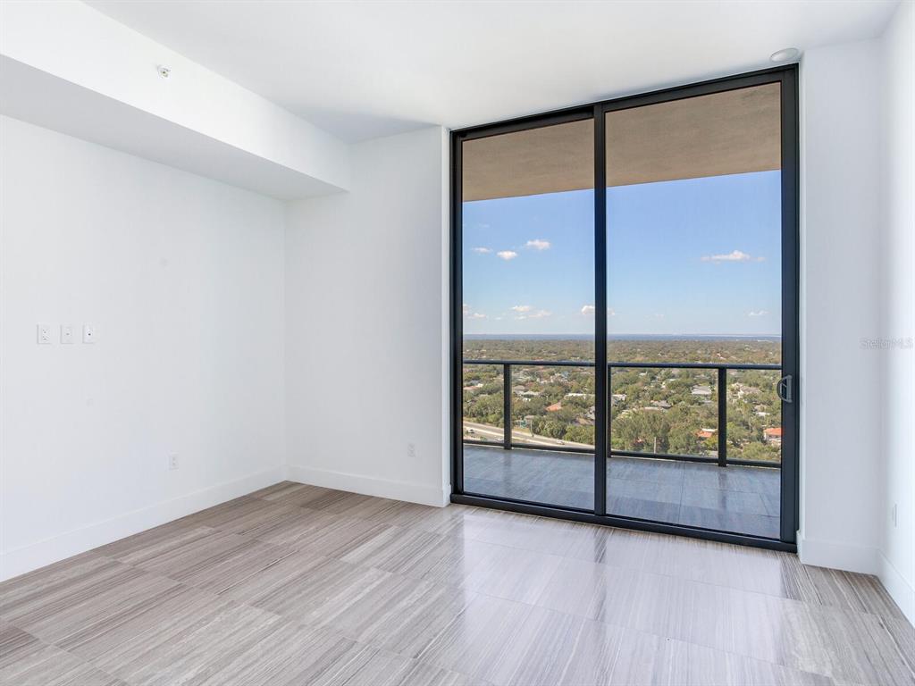 3101 Bayshore Boulevard, Unit 2204 Tampa, FL 33629 - Photo 41 of 60 wooden floor in an empty room with a window