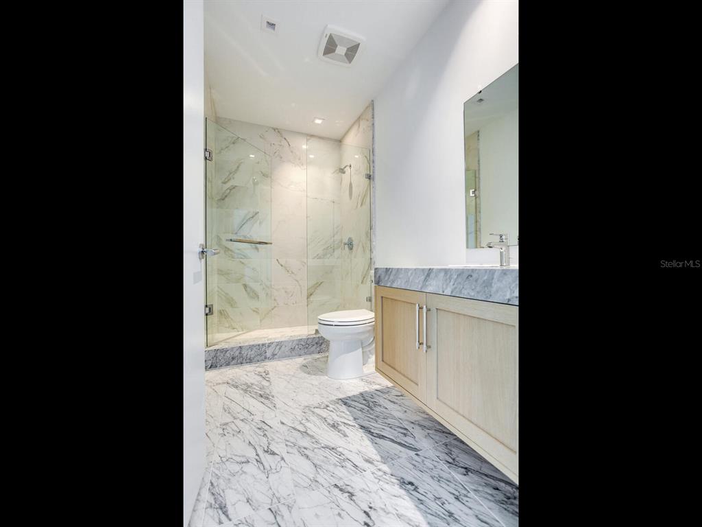 3101 Bayshore Boulevard, Unit 2204 Tampa, FL 33629 - Photo 43 of 60 a bathroom with a sink a toilet and shower