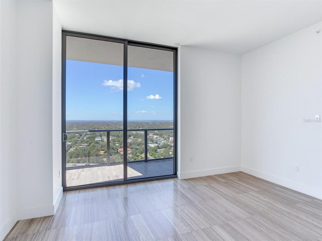 3101 Bayshore Boulevard, Unit 2204 Tampa, FL 33629 - Photo 45 of 60 wooden floor in an empty room with a window