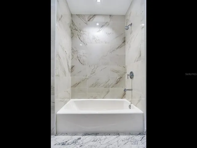 a living room filled with furniture and a table