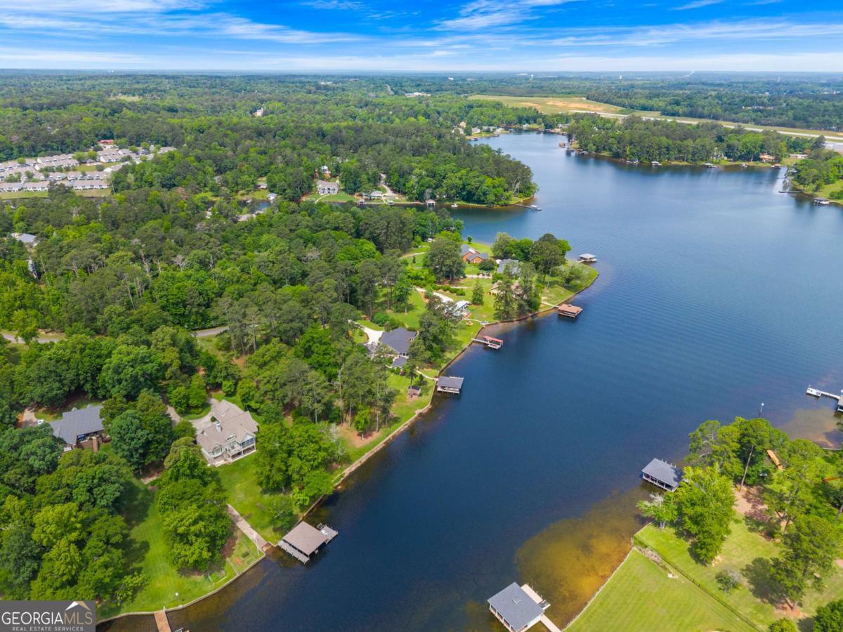 151 Bill Johnson Road Northeast Milledgeville, GA 31061 - Photo 15 of 27 a view of a lake with a mountain in the background